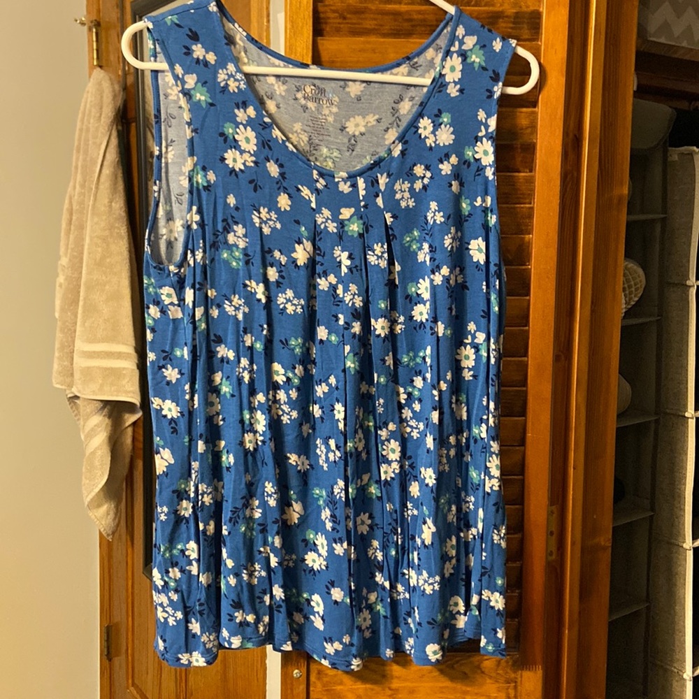 Blue tunic with white floral design.